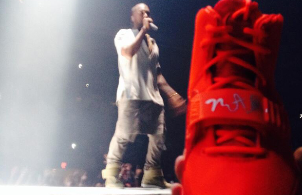 Kanye West Signs Fans Nike Air Yeezy 2 “Red October” at Concert
